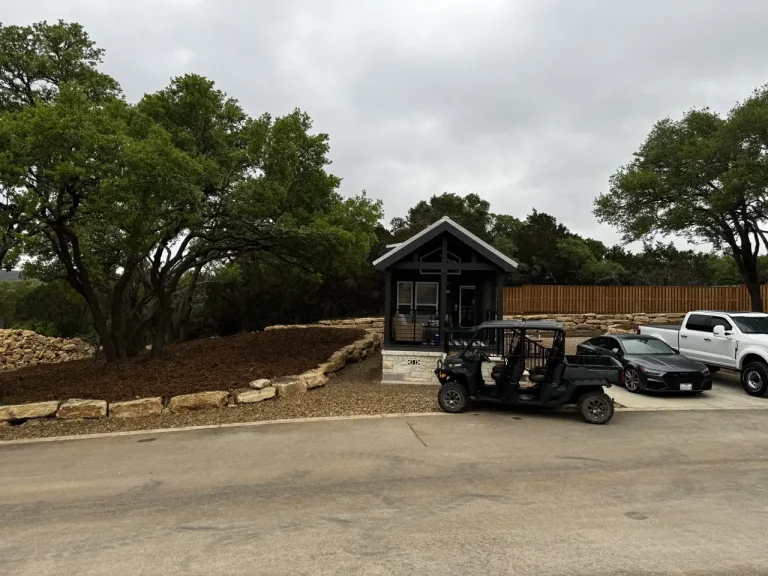 exterior view of luxury Cabins amongst trees and grass