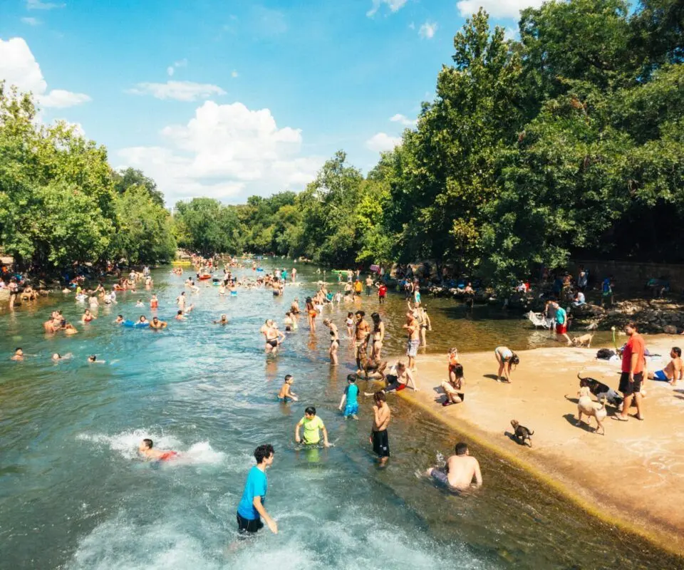 People gathering around a Texas Hill Country swimming hole